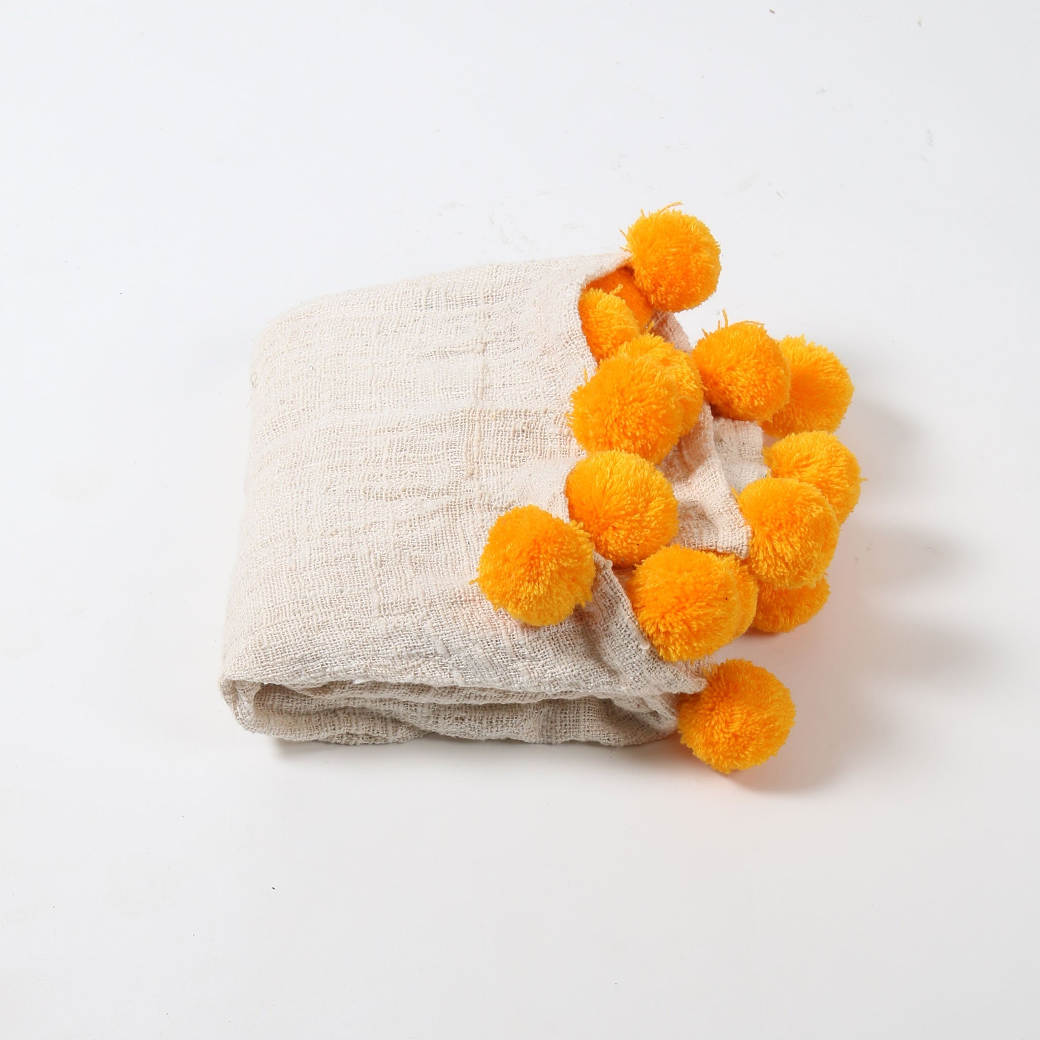 Cream Cotton Textured Throw with Orange Pom Poms