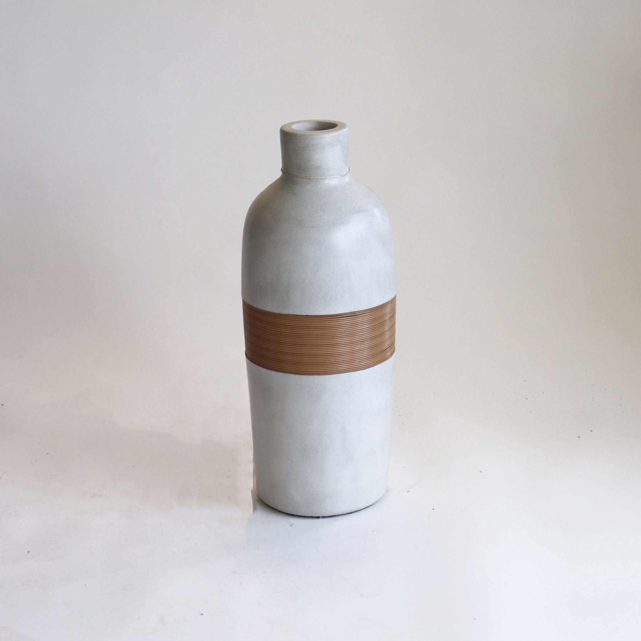 Tall Concrete and Synthetic Rattan Pottery