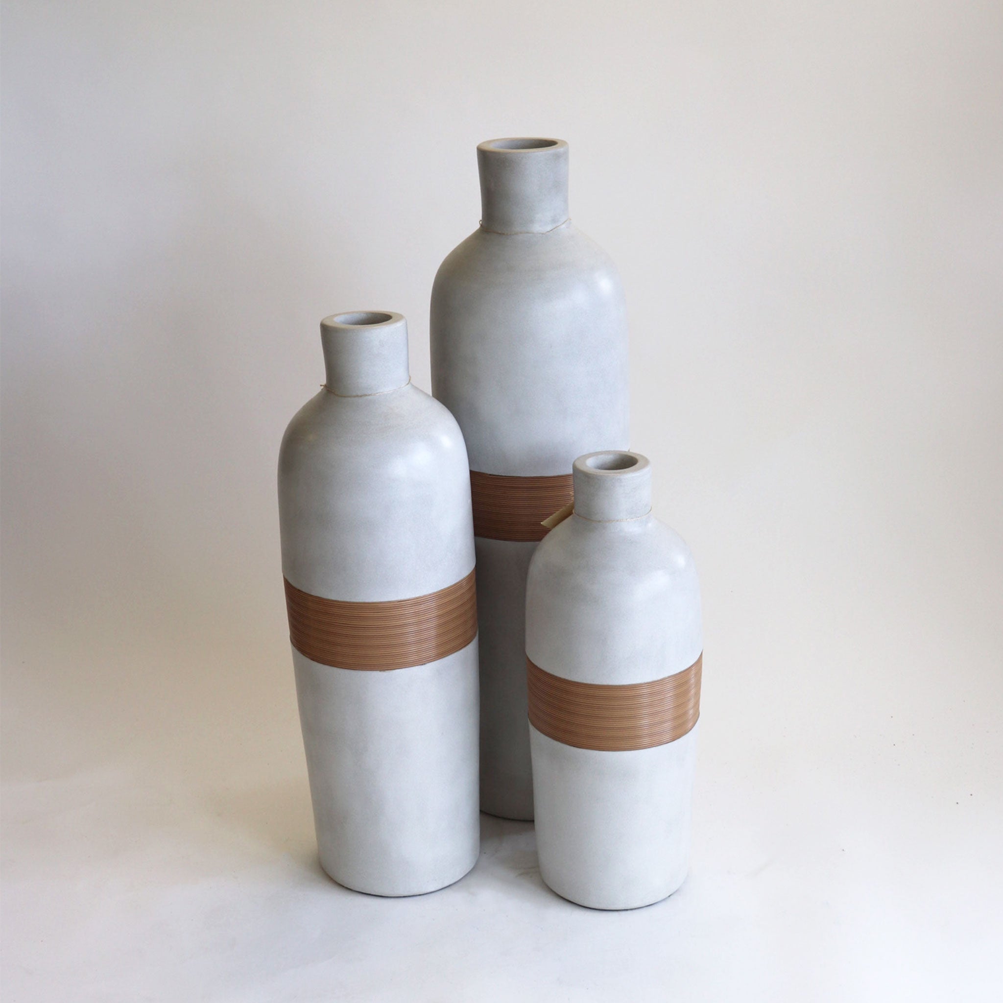 Tall Concrete and Synthetic Rattan Pottery